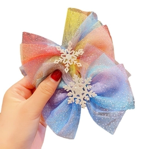 Glittering rainbow mesh hair bow clips with white snowflake charms for young girls