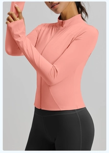 Side view of coral pink slim fit zip-up sports jacket with stand collar and stretch fabric