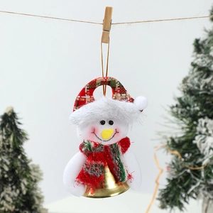 Detail of plush snowman Christmas ornament with golden bell and plaid scarf decoration
