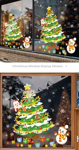 Detail of Christmas window clings featuring Santa Claus, snowmen, and festive trees