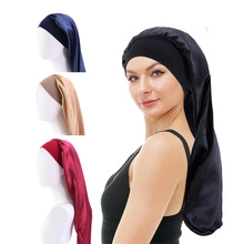 Detail of multi-color long satin sleep caps with wide elastic bands for curly hair care