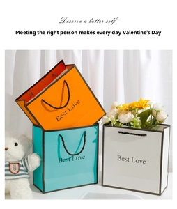 Three elegant gift bags in orange, blue, and white with Best Love lettering and black ropes