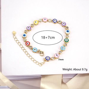 Detail view showing colorful enamel evil eye beads and clear zircons with size specs