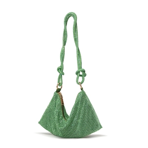 Macro view of triangular emerald green rhinestone evening bag with beaded strap