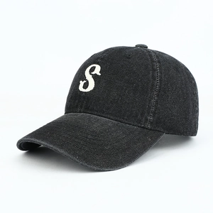 Close-up of premium washed denim baseball cap with 3D white letter S embroidery detail