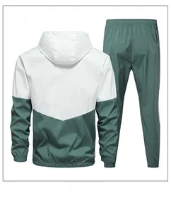 Detail of green and white color-block tracksuit set showing back view of hooded jacket