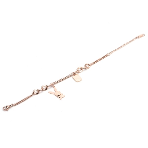 Detail of rose gold snake chain bracelet with rabbit pendant and rectangular charm
