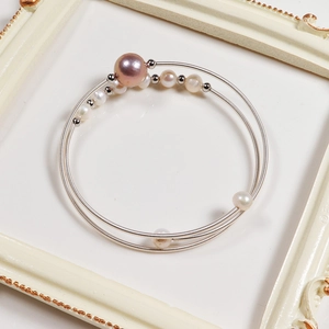 Double-layer freshwater pearl wrap bracelet with purple and white pearls in a vintage frame