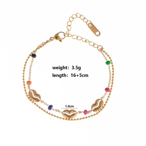 Double-layered gold chain bracelet with colorful round beads and hollow lip pendants