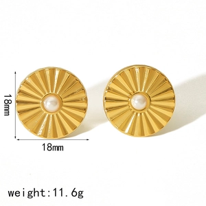Detailed view of 18mm gold wave-patterned stud earrings with central pearl inlay