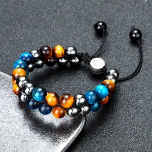 Woven double-layer bracelet with tiger eye stones and adjustable black cord closure