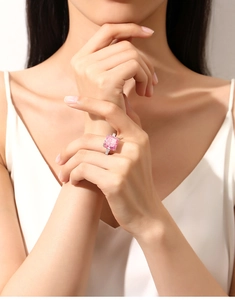 Detail showing an s925 silver ring with a large pink gemstone worn on a hand