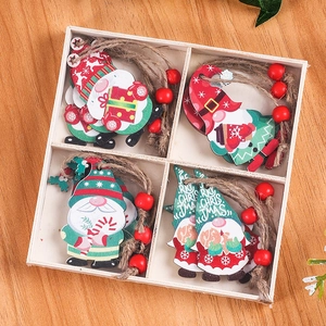 Detail of 12pcs wooden gnome ornaments with red beads and twine in a divided wooden tray