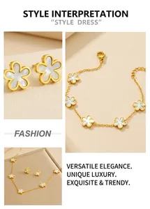 Detail of gold floral jewelry set featuring clover-shaped necklace, bracelet and earrings