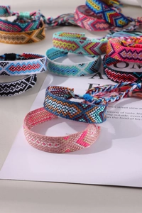 Detailed view of colorful handmade Bohemian friendship bracelets with geometric patterns