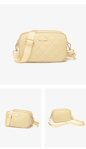Detailed views of beige quilted camera bag with adjustable wide fabric shoulder strap