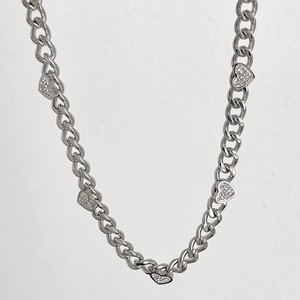 Silver curb chain necklace with five rhinestone-encrusted heart pendants for women
