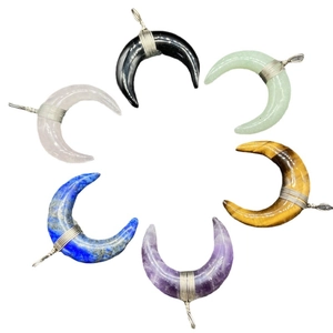 Six wire-wrapped crescent moon necklaces in assorted semi-precious gemstones and crystals