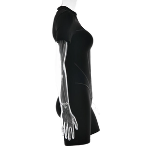 Side view of black short sleeve bodysuit with white contrast stitching and front zipper detail