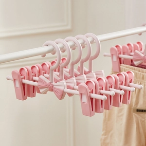 Adjustable Telescopic Kids Pants Hangers With Clips Non Slip PP Plastic Bowknot Design For Baby Clothes