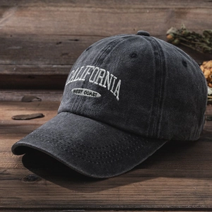 Detail of embroidered California West Coast text on vintage washed grey baseball cap
