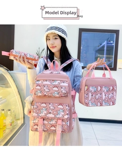 Detailed pink schoolbag set with unicorn prints including backpack, lunch bag, and pencil case