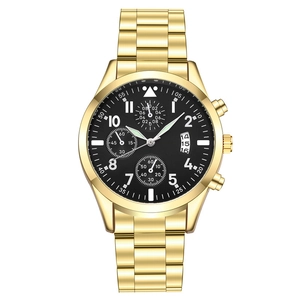 Detailed close-up of gold stainless steel chronograph watch with black dial and three sub-dials