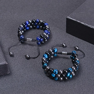 Detail of blue tiger eye beaded bracelet with adjustable black braided cord and beads