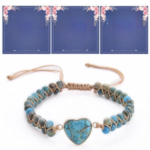 Detail of heart-shaped turquoise bracelet with personalized message gift cards