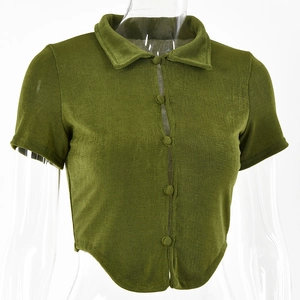 Macro detail of green short-sleeved cropped cardigan with double-layered button placket