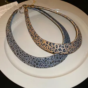 Vintage leopard print metal choker necklaces in gold and blue grey tones