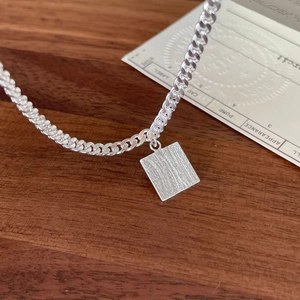 Minimalist 925 silver box chain necklace with square brushed metal pendant on wood surface