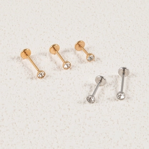 Detailed view of stainless steel ball stud earrings set with clear zircon stones