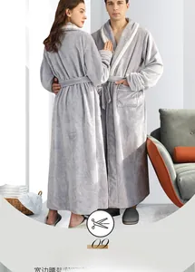Detail view of thick flannel bathrobe with contrasting white piping and belted waist