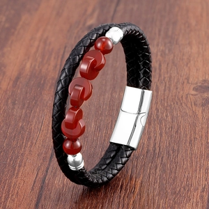 Close-up of double-layer black braided leather bracelet with red agate beads and metal clasp