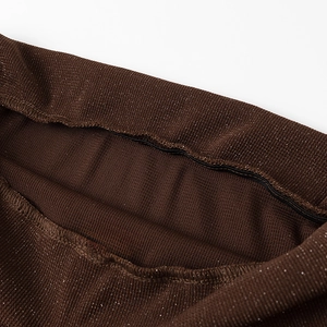 Close-up of dark brown knit fabric with shimmering metallic threads and detailed stitching