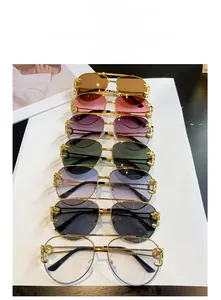 Detailed view of leopard head metal relief on double bridge pilot sunglasses frames