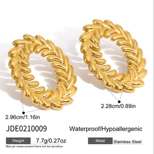 Detail view of gold wheat leaf stainless steel earrings with size and weight specs