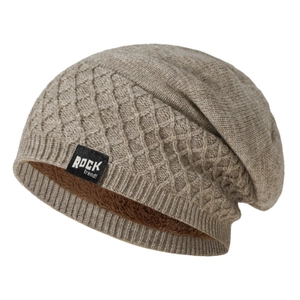 Detail of warm winter beanie featuring thick brown fleece lining and knitted diamond pattern