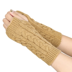 Detail of camel knit arm warmers showing the vintage cable pattern and fingerless design