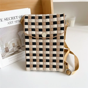 Detail of checkered knit phone bag showing brown and black patterns with round button