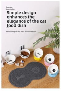 Detail of wall-mounted ceramic cat bowls with non-slip fish mat and solid wood stand