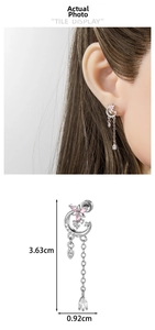 Detail of asymmetric moon and star tassel earring with precise measurements 3.63cm by 0.92cm