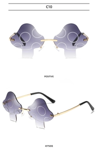 Dual view of mushroom-shaped rimless sunglasses with purple gradient lenses and gold frames
