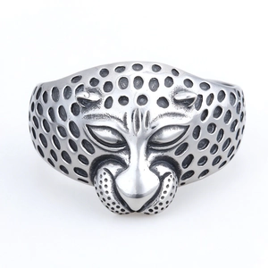 Polished silver stainless steel leopard head open bracelet featuring detailed spot textures