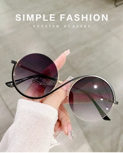 Macro detail of purple gradient lenses and metal frame with specifications engraved on temple