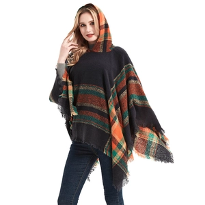 Women's plaid hooded poncho shawl with fringe hem in orange and green tartan pattern