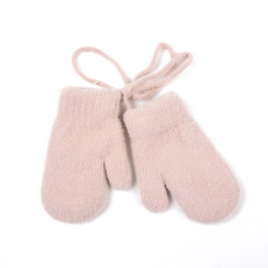 Detail of pink plush baby mittens with a knitted anti-lost string and soft fur texture