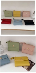 Collection of tri-fold wallets in six colors with wrist straps and metal snap closure