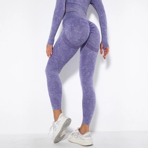Detail of high waist seamless leggings with peach butt lifting design in purple acid wash